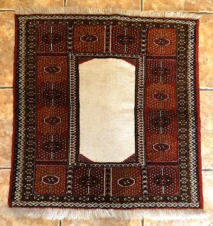 An especial Persian hand-knotted wool, mix of kilim and red colour Baluch design rug with a cream kilim in the centre
